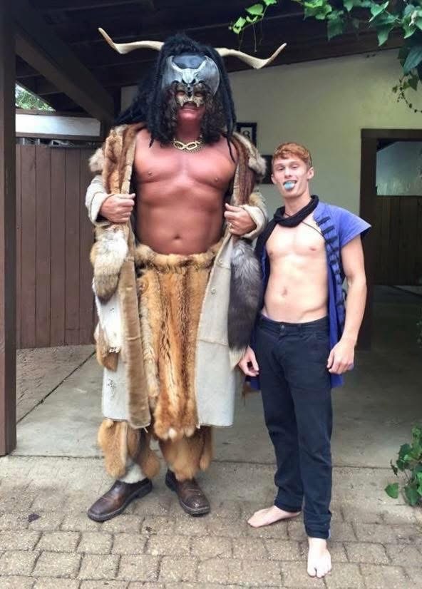 Phil in a horned costume beside a friend