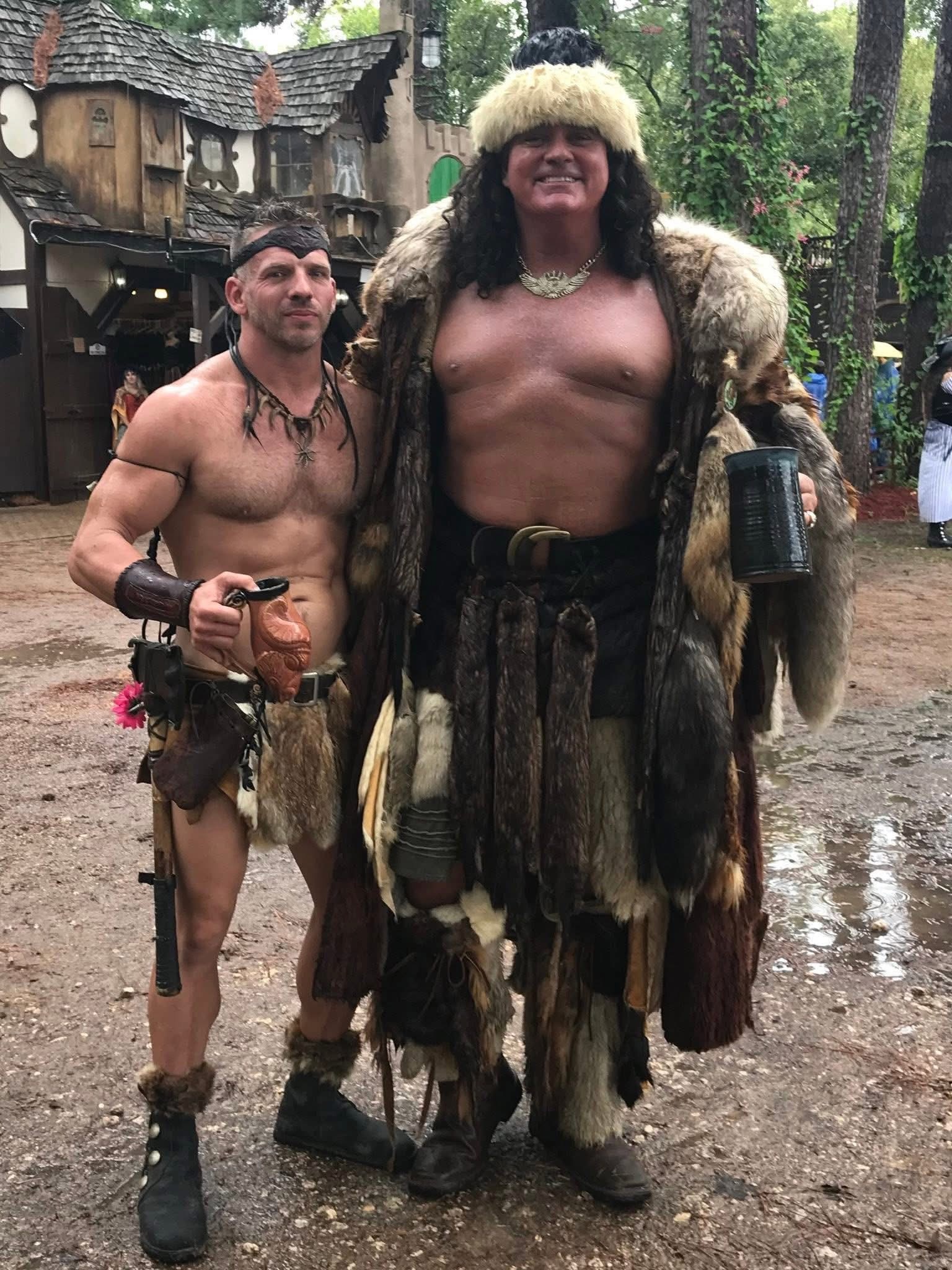 Phil and a friend in fur costumes at a festival