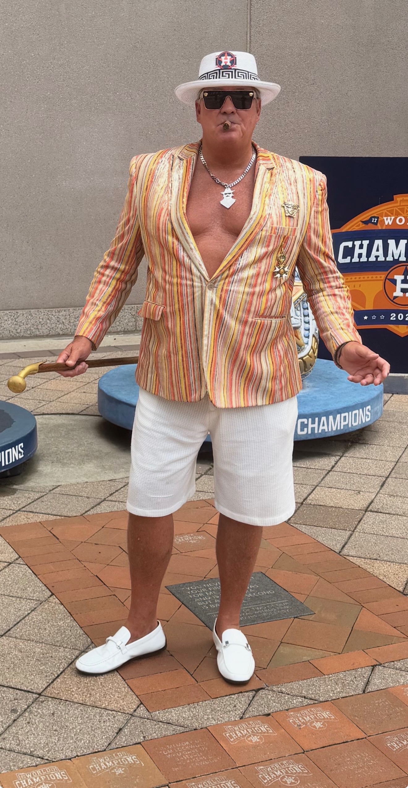 Phil wearing an Astros hat and striped jacket