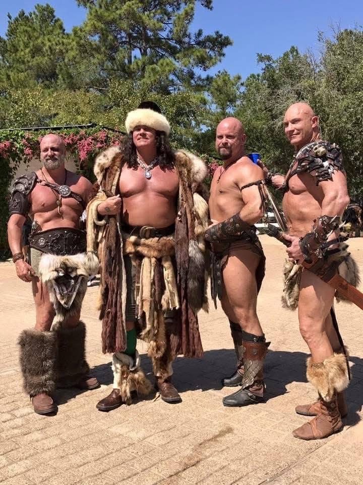 Phil with three friends in festival costumes