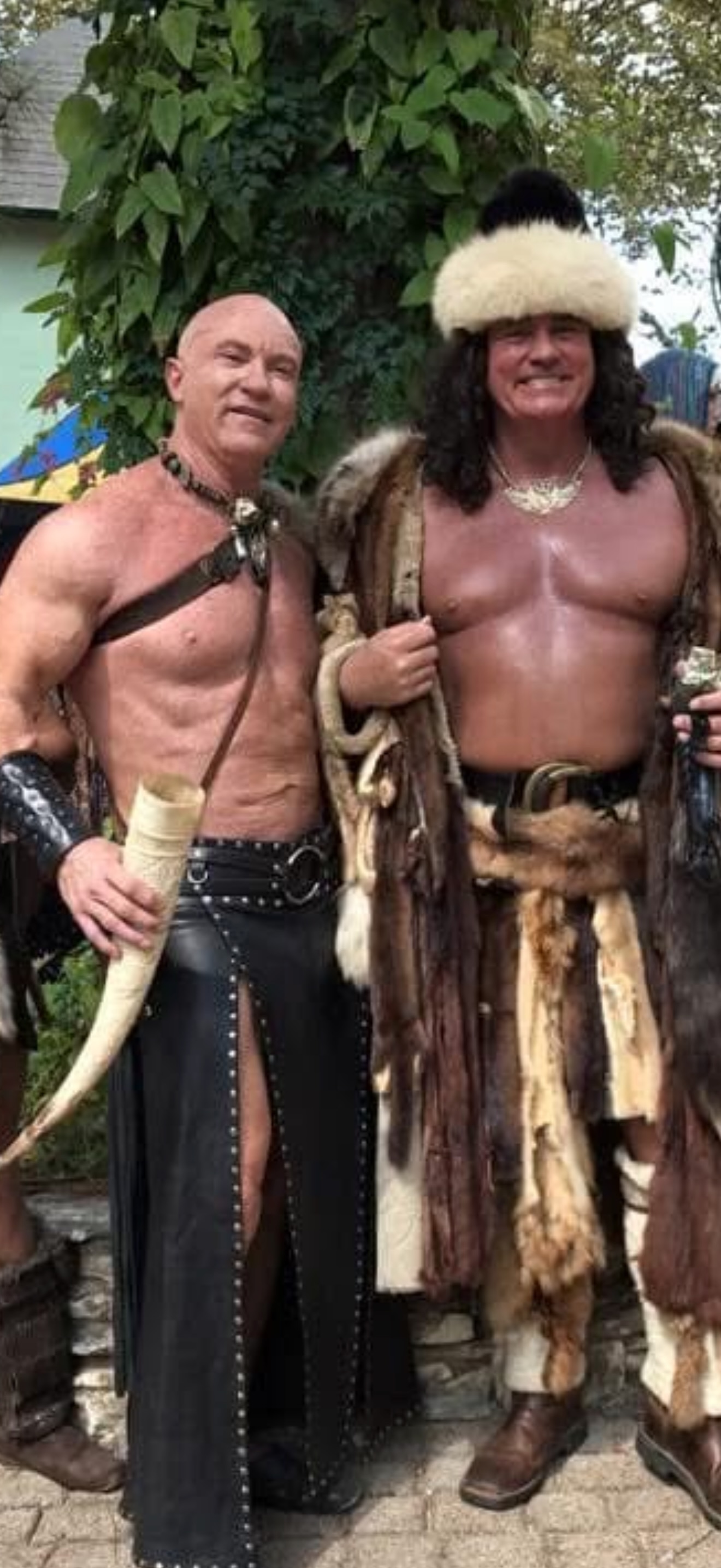 Phil and a friend holding drinking horns