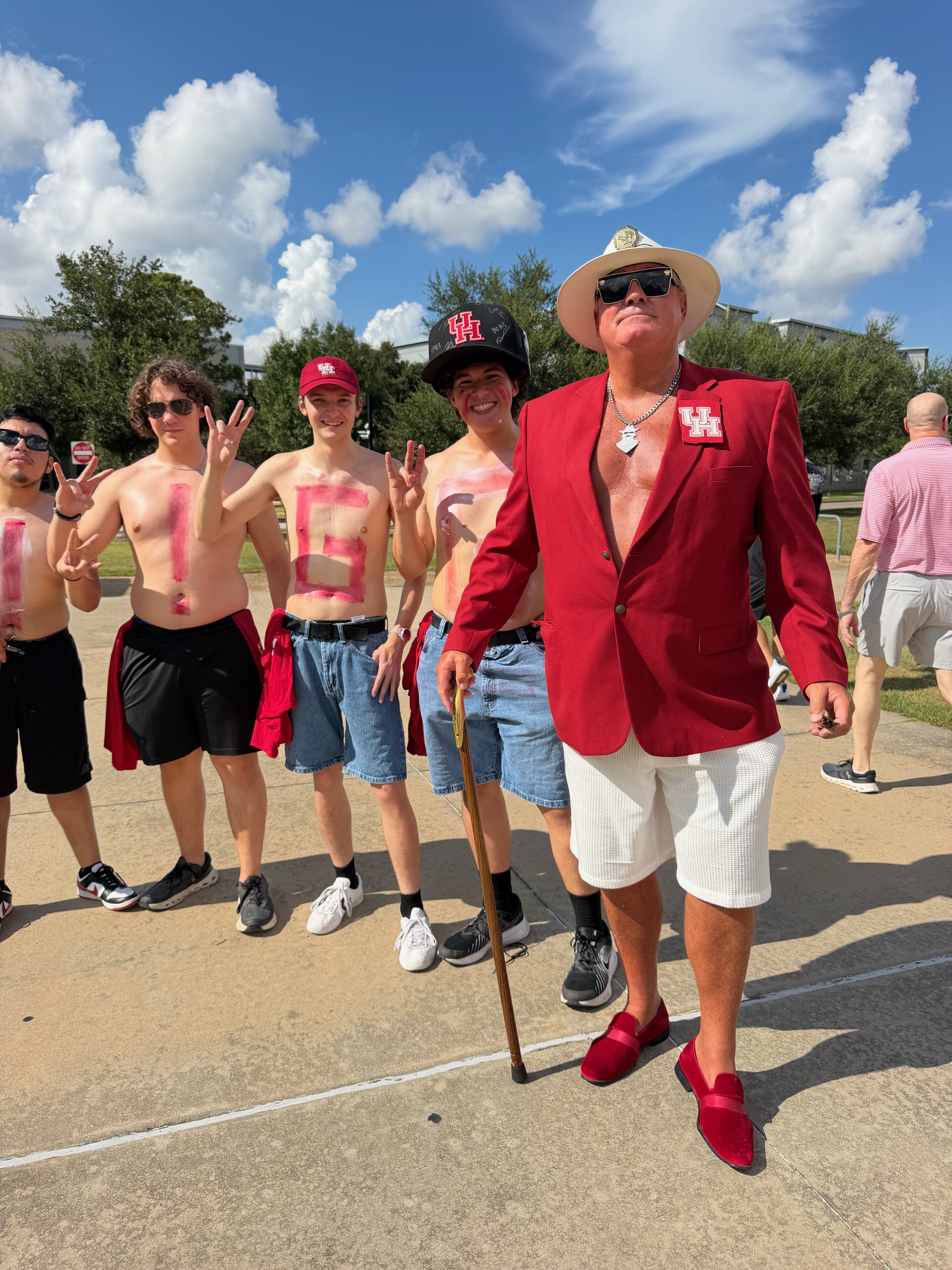Phil in a red jacket with a group of Houston fans